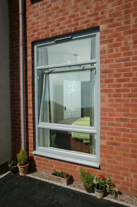 grey tilt window stone house
