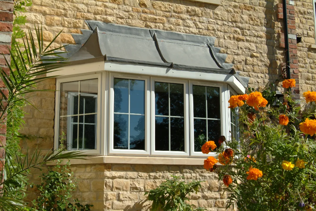 white bay window installed at stone house