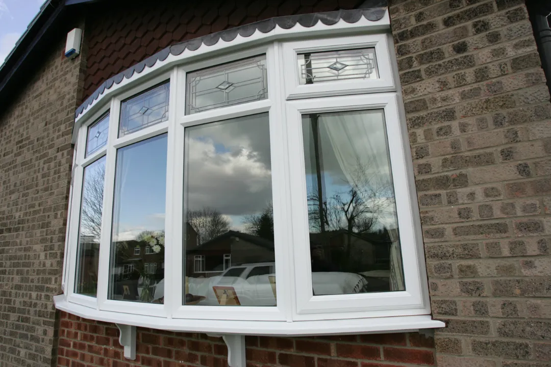 white bow window brick house